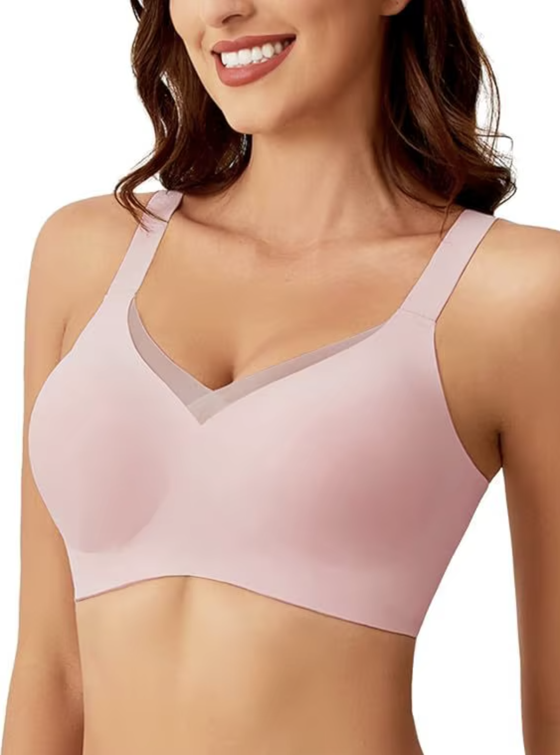 Pink convertible crossover bra with adjustable straps, seamless fabric, and mesh texture, branded by On The Rack