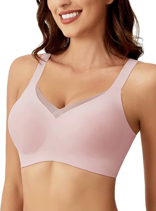 Pink convertible crossover bra with adjustable straps, seamless fabric, and mesh texture, branded by On The Rack
