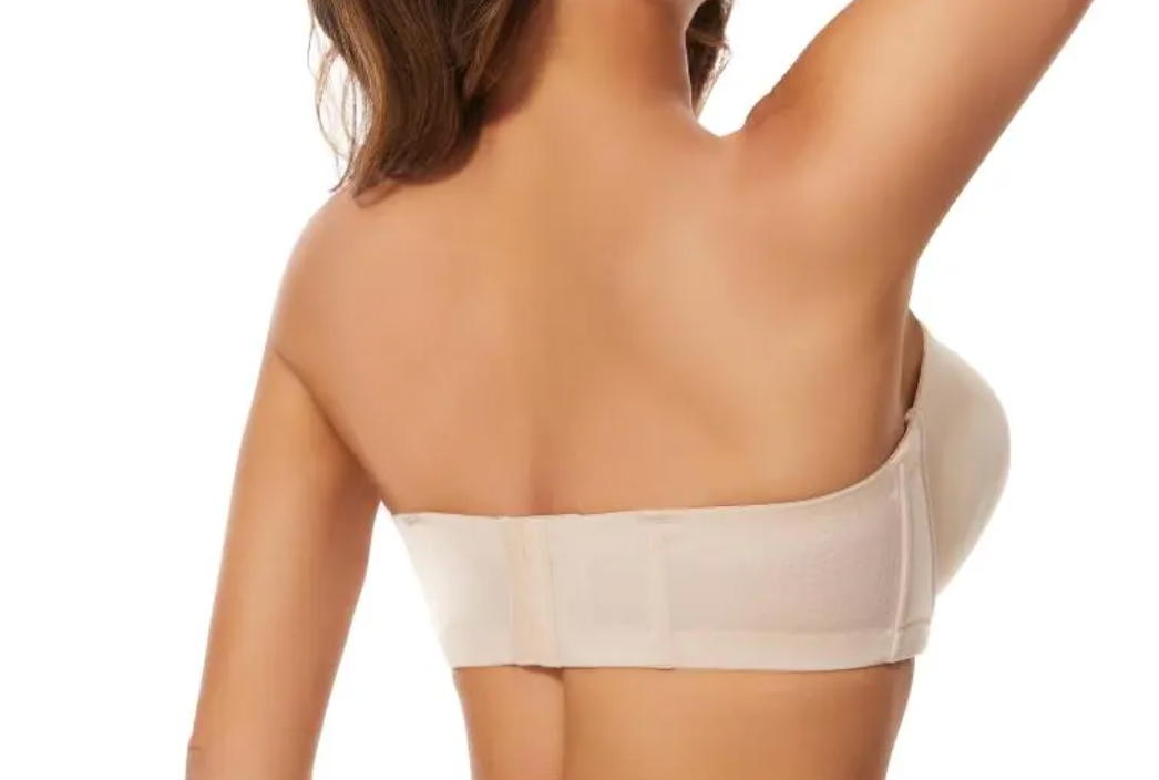 Close-up of the black nylon and mesh fabric with subtle stitching details on the EVENT Bra strap edge